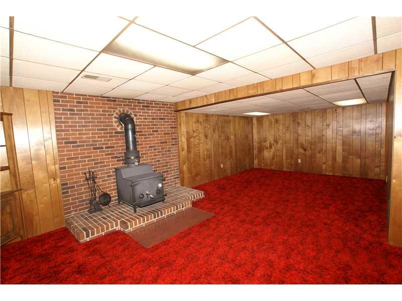 231 Seavey Road Pittsburgh, PA 15223 - Photo 11 of 14 Family Room. Large game room with woodburner