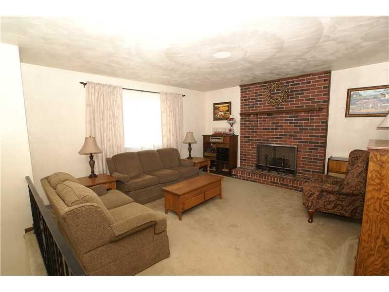 231 Seavey Road Pittsburgh, PA 15223 - Photo 3 of 14 Living Room. Another view of the living room with log burning fireplace.
