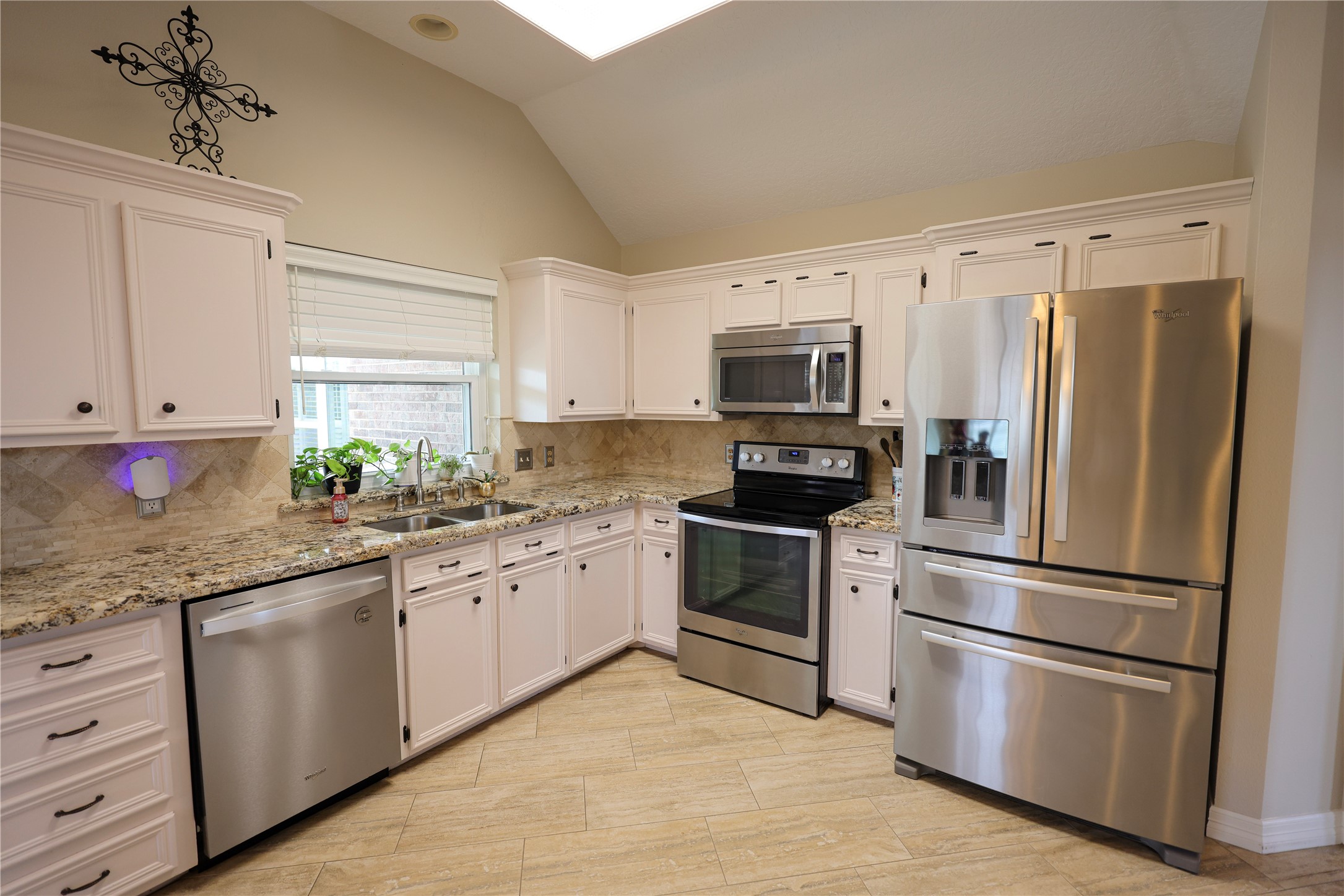 4 Lasso Court Angleton, TX 77515 - Photo 15 of 36 Granite countertops and tile floors in kitchen