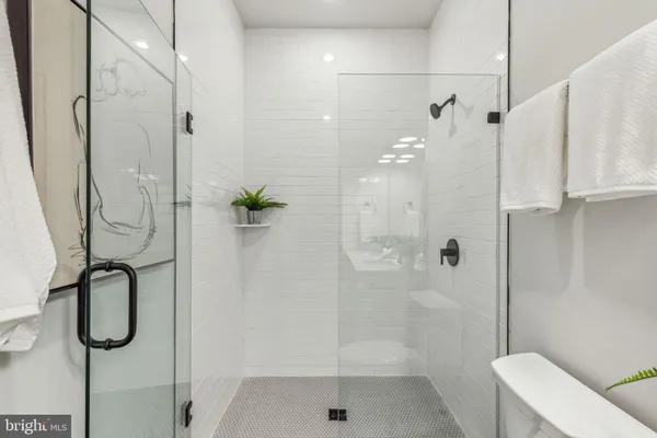 a bathroom with a shower and a shower