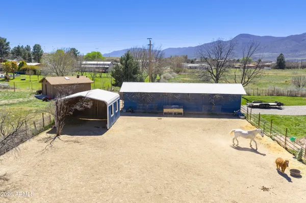 a view of a swimming pool and a yard