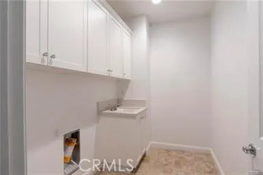 a view of storage and utility room with empty racks