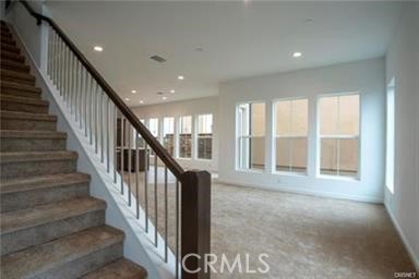20801 Bur Oak Circle Porter Ranch, CA 91326 - Photo 2 of 35 a view of an entryway with wooden floor and door