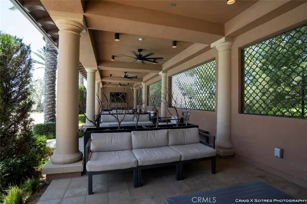 a outdoor living space with furniture and a potted plant