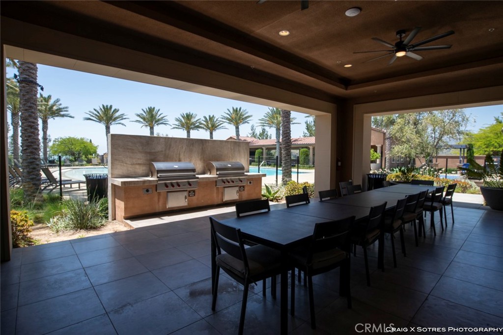20801 Bur Oak Circle Porter Ranch, CA 91326 - Photo 26 of 35 a kitchen with a table chairs and wooden floor