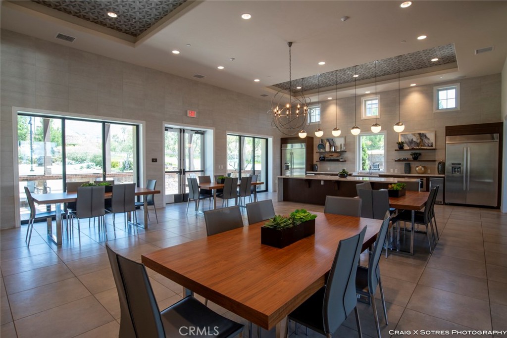 20801 Bur Oak Circle Porter Ranch, CA 91326 - Photo 27 of 35 a view of a dining room with furniture and wooden floor