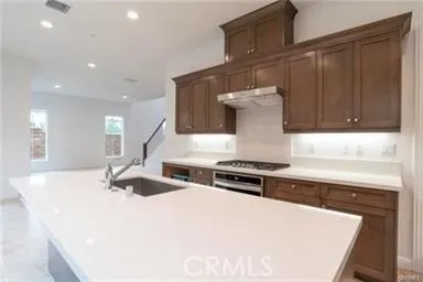 a kitchen with a stove and a sink
