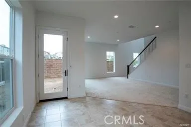 a view of an empty room and a window