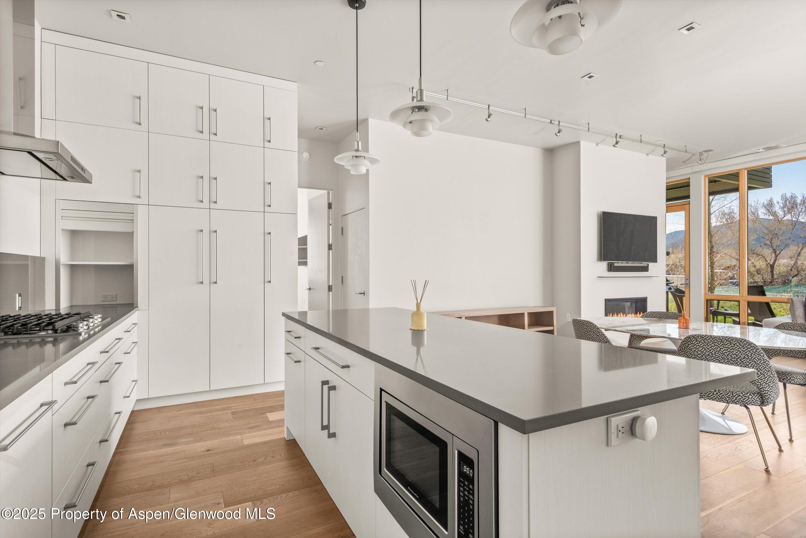 104 Evans Road, Unit 105 Basalt, CO 81621 - Photo 11 of 23 a kitchen with a sink stove and refrigerator