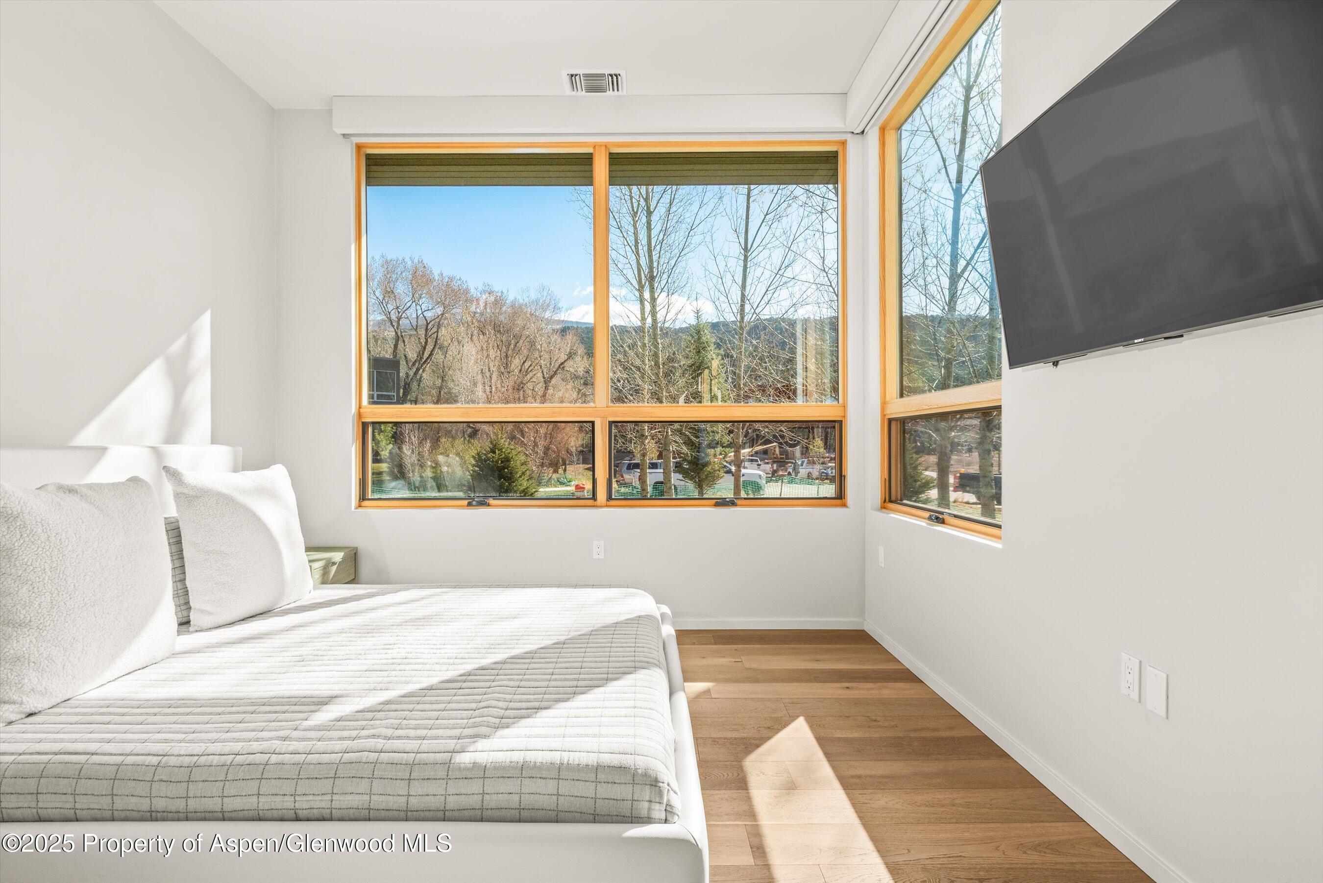 104 Evans Road, Unit 105 Basalt, CO 81621 - Photo 13 of 23 a bedroom with a bed and window