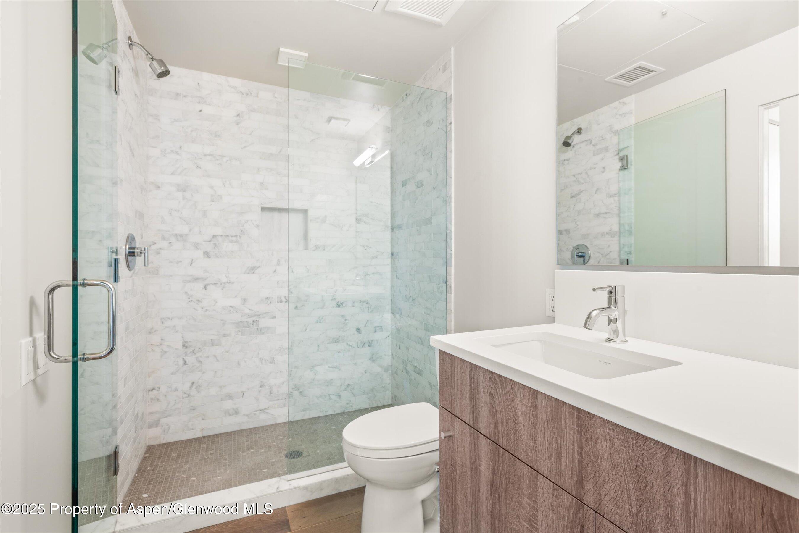 104 Evans Road, Unit 105 Basalt, CO 81621 - Photo 18 of 23 a bathroom with a sink toilet and shower