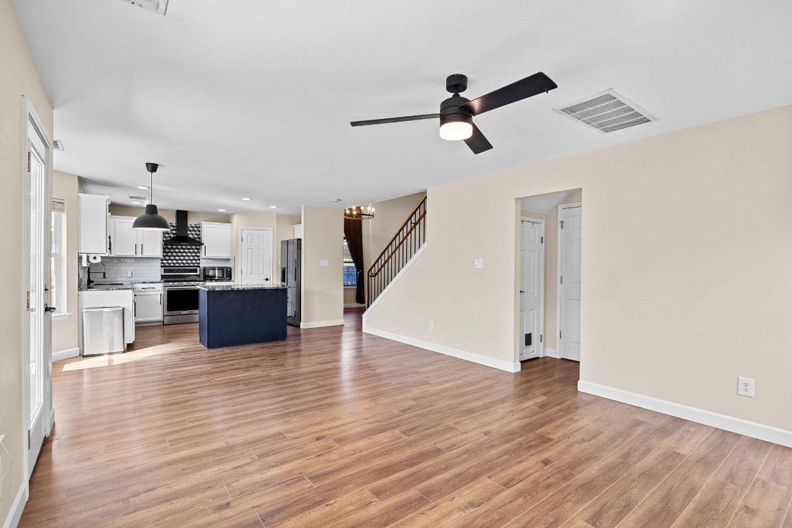 1405 Ty Cobb Place Round Rock, TX 78665 - Photo 11 of 33 a view interior of the house and kitchen view with wooden floor