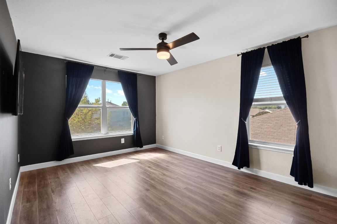 1405 Ty Cobb Place Round Rock, TX 78665 - Photo 19 of 33 wooden floor in an empty room with a window