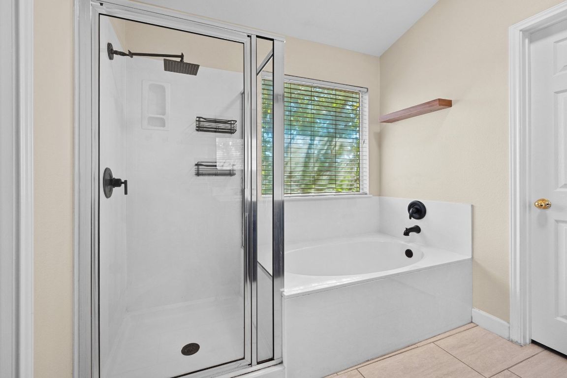 1405 Ty Cobb Place Round Rock, TX 78665 - Photo 25 of 33 a bathroom with a bathtub and shower