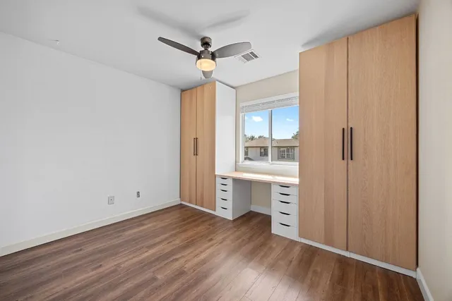 a view of cabinets and wooden floor