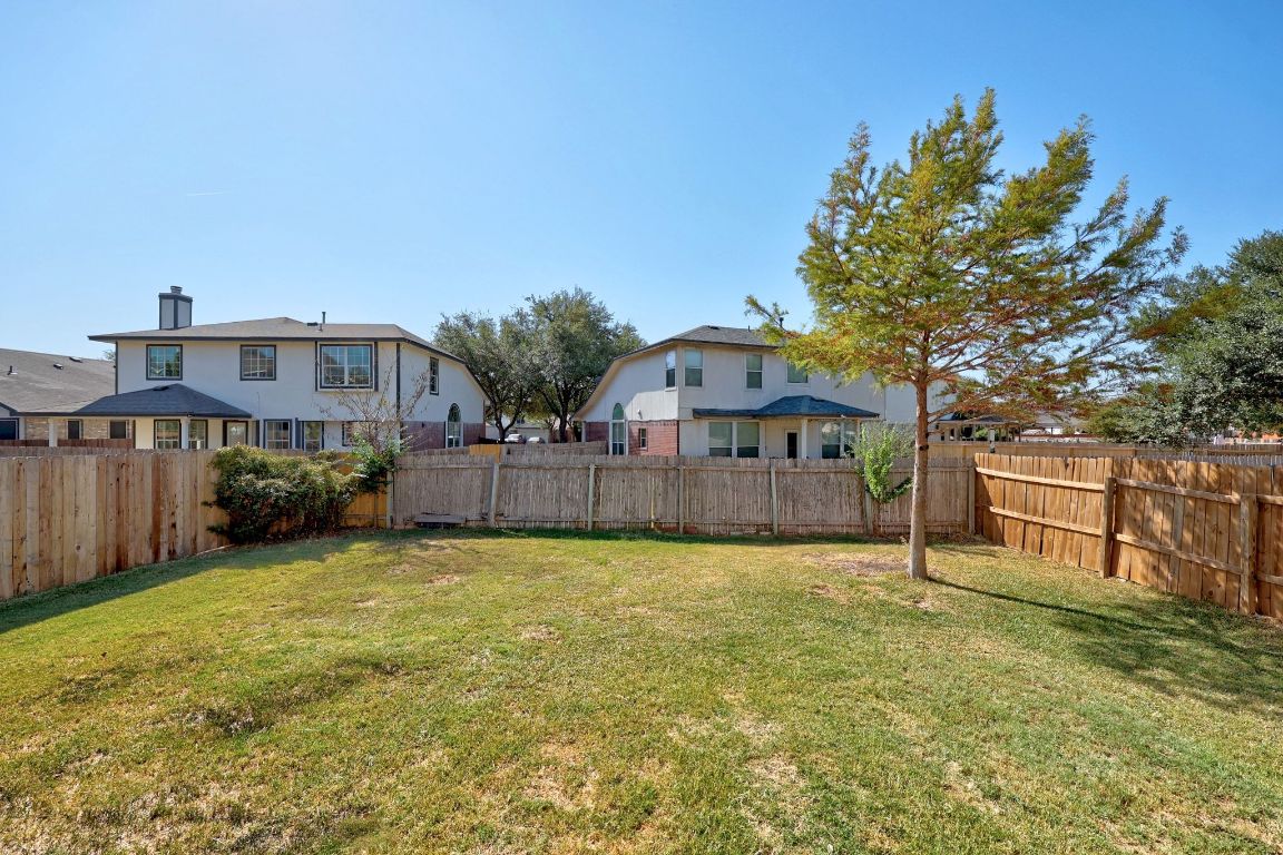 1405 Ty Cobb Place Round Rock, TX 78665 - Photo 31 of 33 a view of a house with a yard and deck