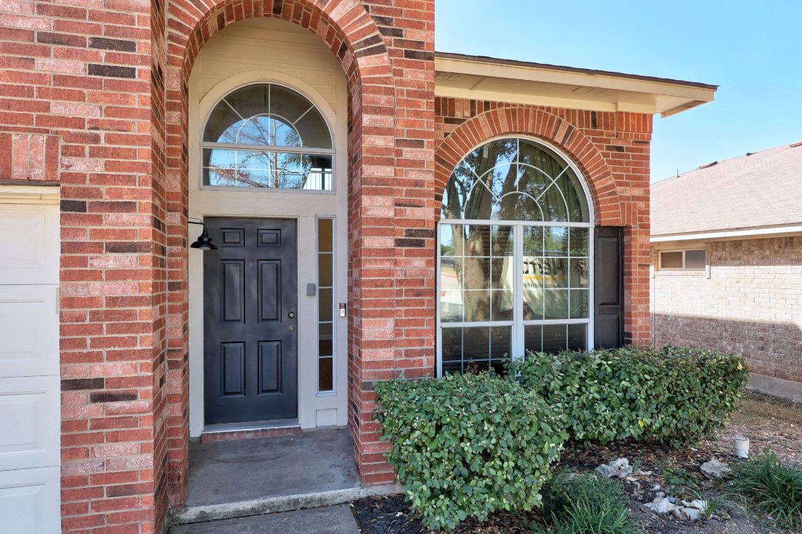 1405 Ty Cobb Place Round Rock, TX 78665 - Photo 4 of 33 a front view of a house with garden