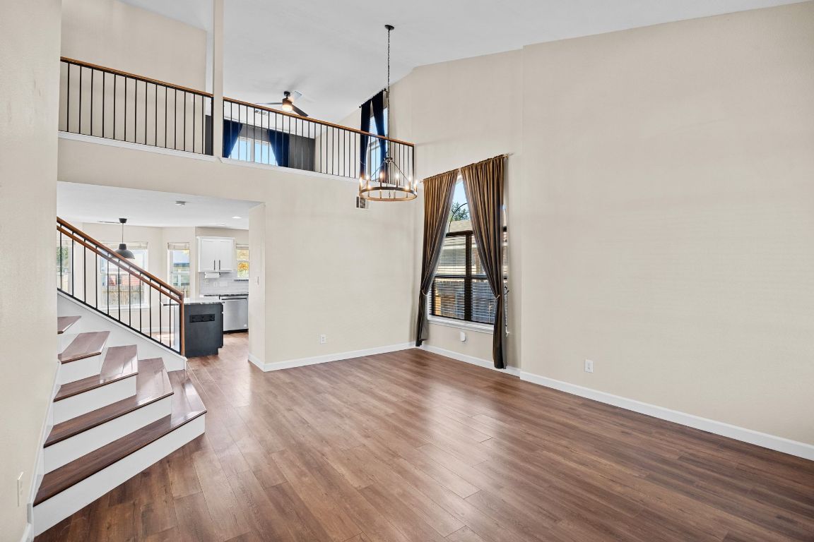 1405 Ty Cobb Place Round Rock, TX 78665 - Photo 5 of 33 a view of a hallway with wooden floor and staircase