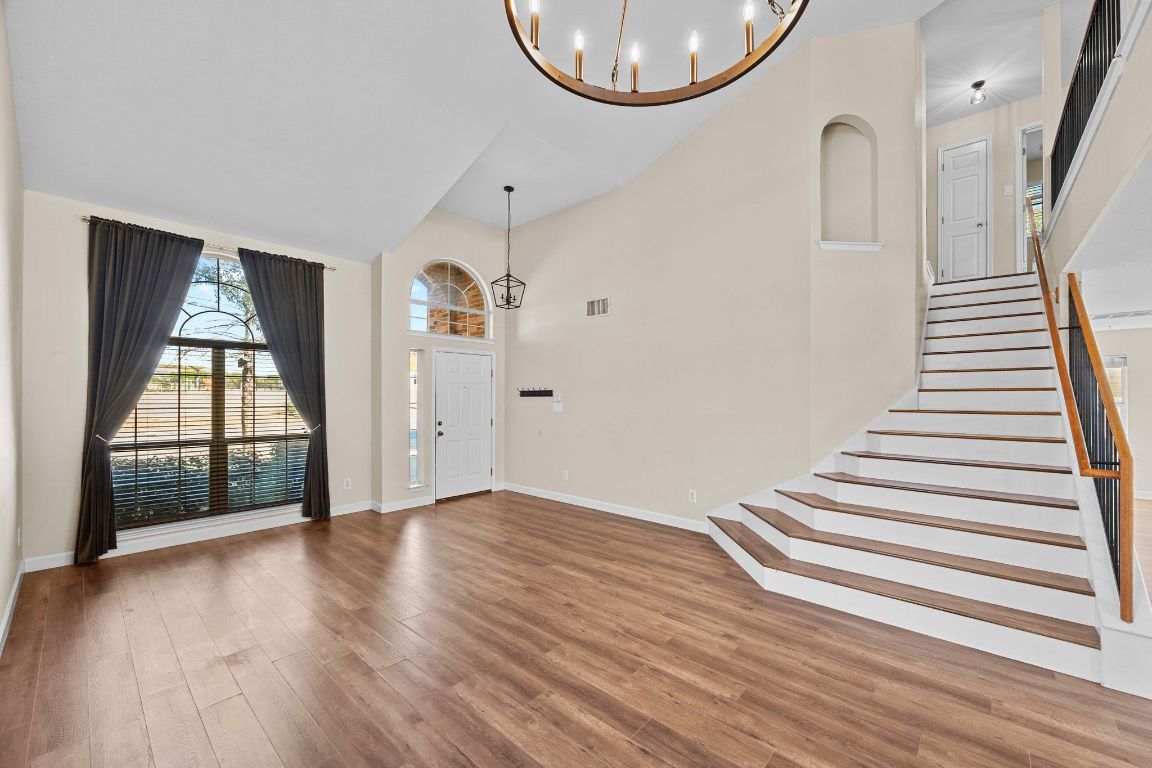 1405 Ty Cobb Place Round Rock, TX 78665 - Photo 6 of 33 a view of a livingroom with wooden floor and a large window