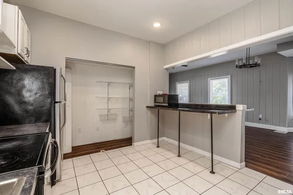 a kitchen with cabinets and appliances