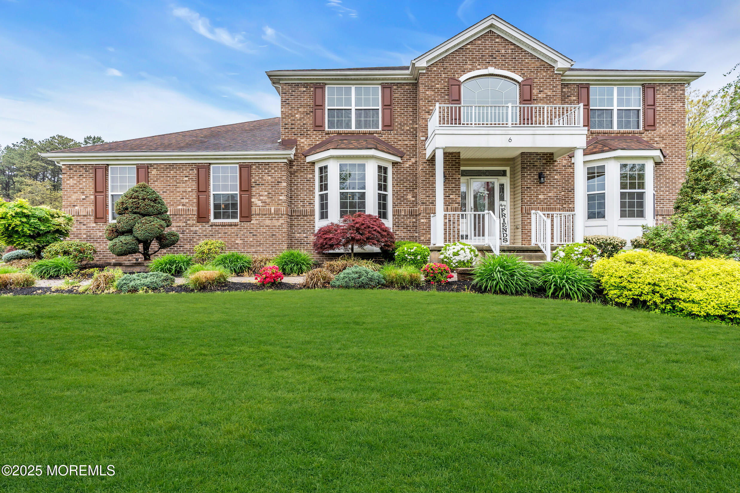 6 Firenze Road Jackson, NJ 08527 - Photo 2 of 57 a front view of a house with garden and porch