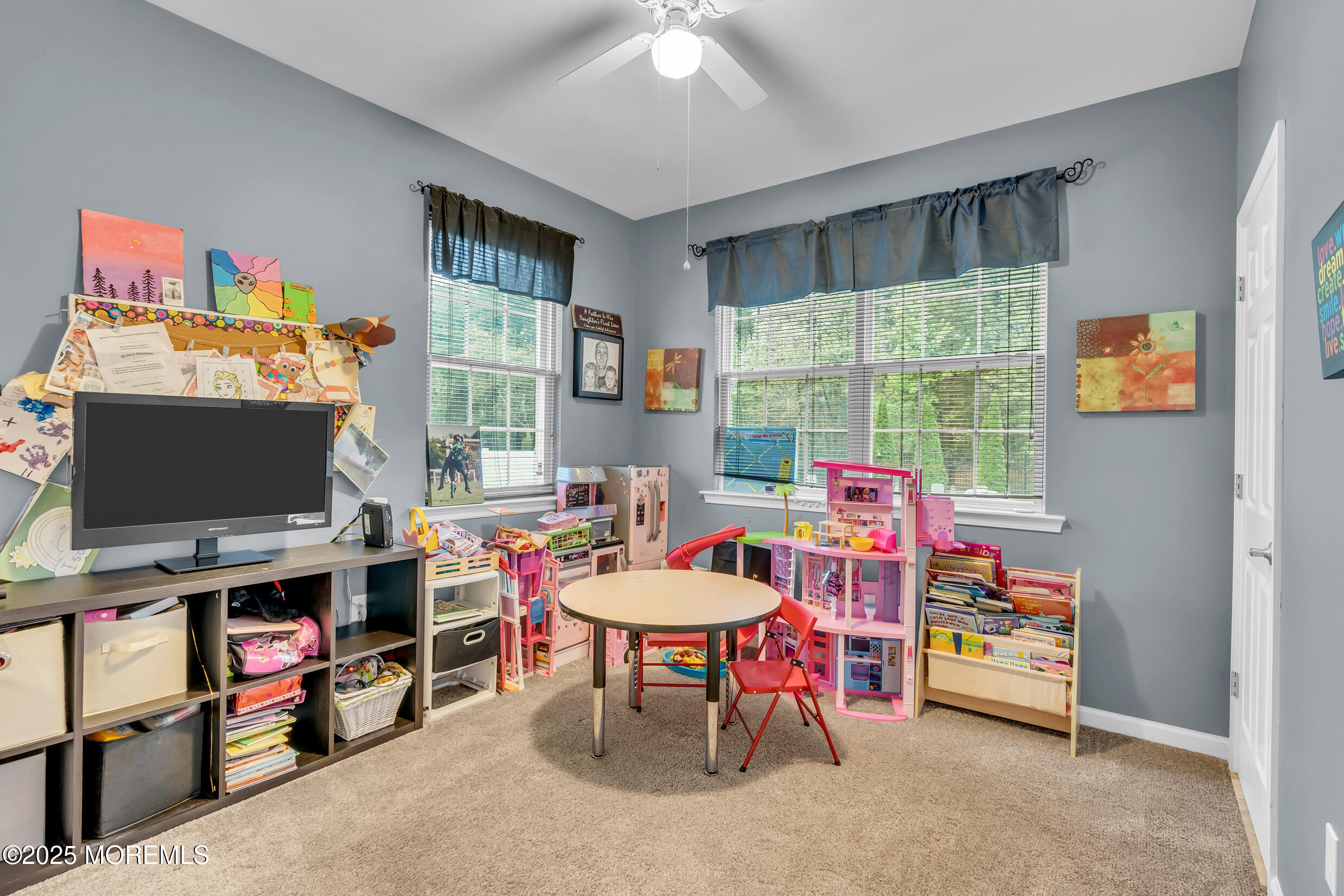 6 Firenze Road Jackson, NJ 08527 - Photo 23 of 57 a children room with furniture and a flat screen tv