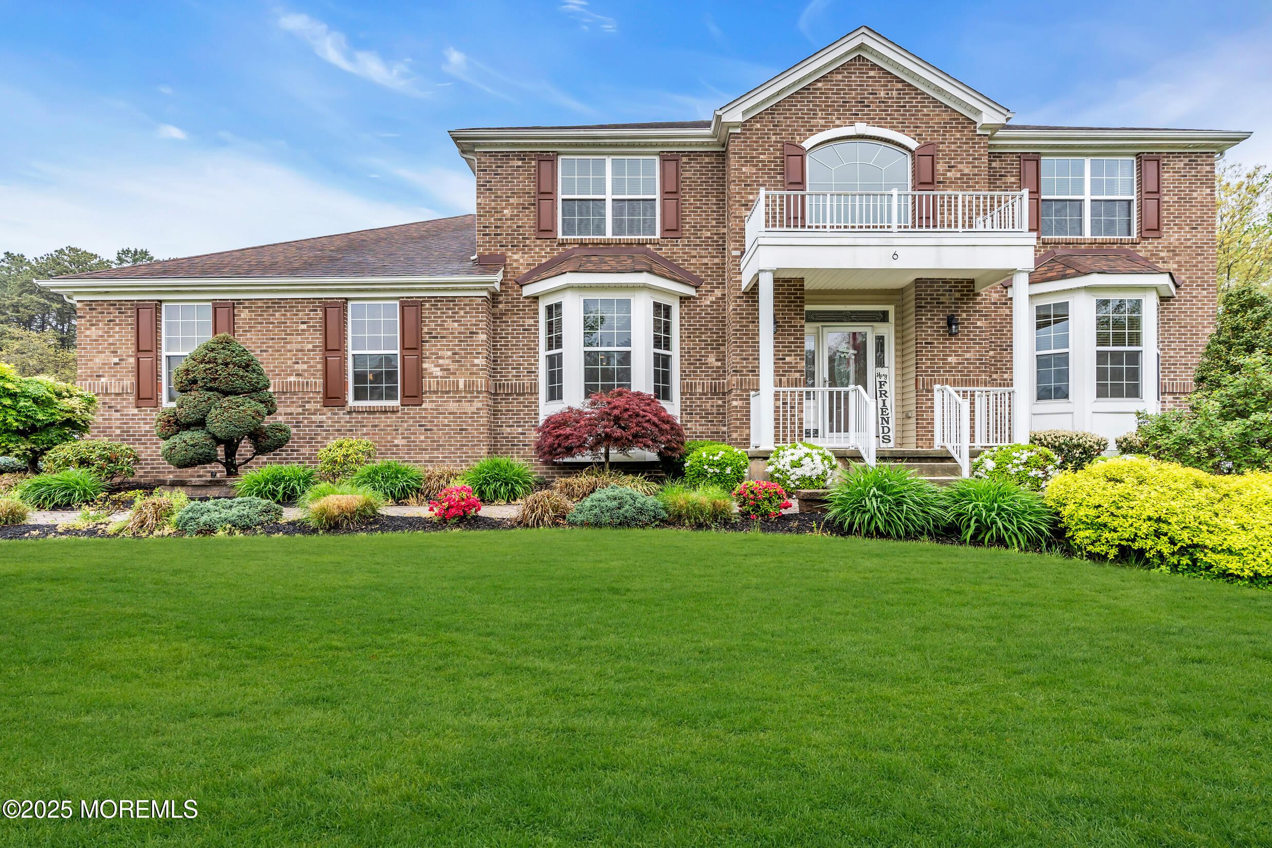 6 Firenze Road Jackson, NJ 08527 - Photo 3 of 57 a front view of a house with garden and porch