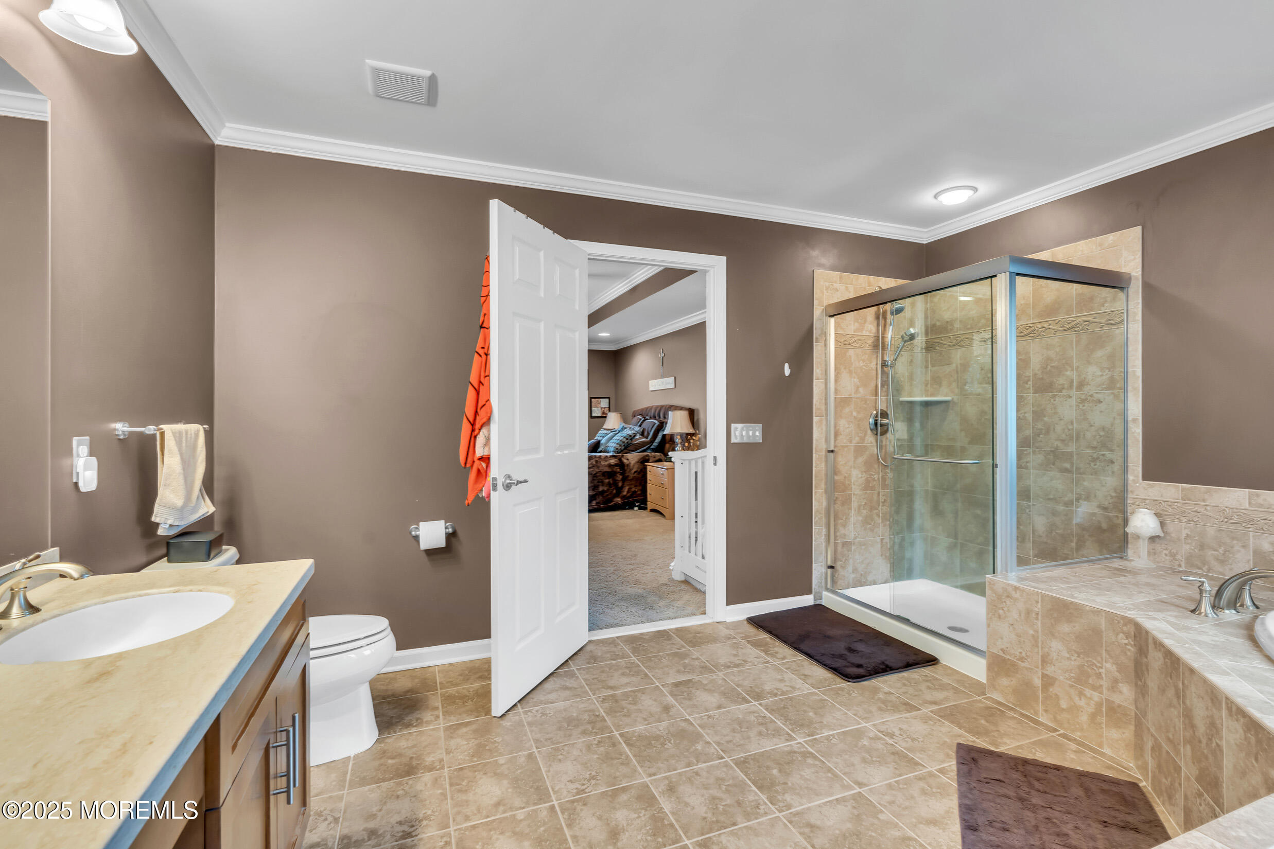 6 Firenze Road Jackson, NJ 08527 - Photo 32 of 57 a spacious bathroom with a granite countertop sink and a mirror