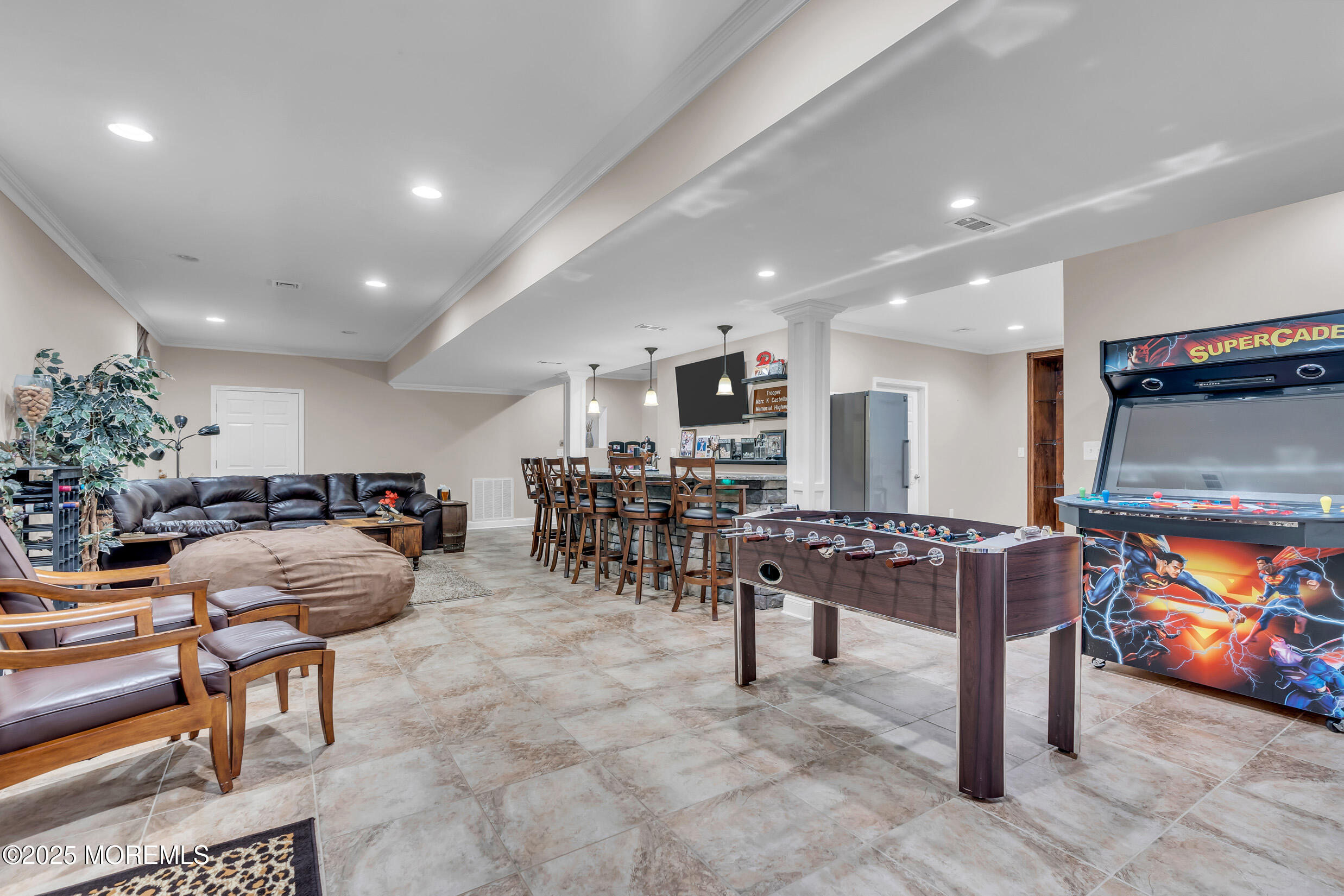 6 Firenze Road Jackson, NJ 08527 - Photo 38 of 57 a living room with furniture and a flat screen tv