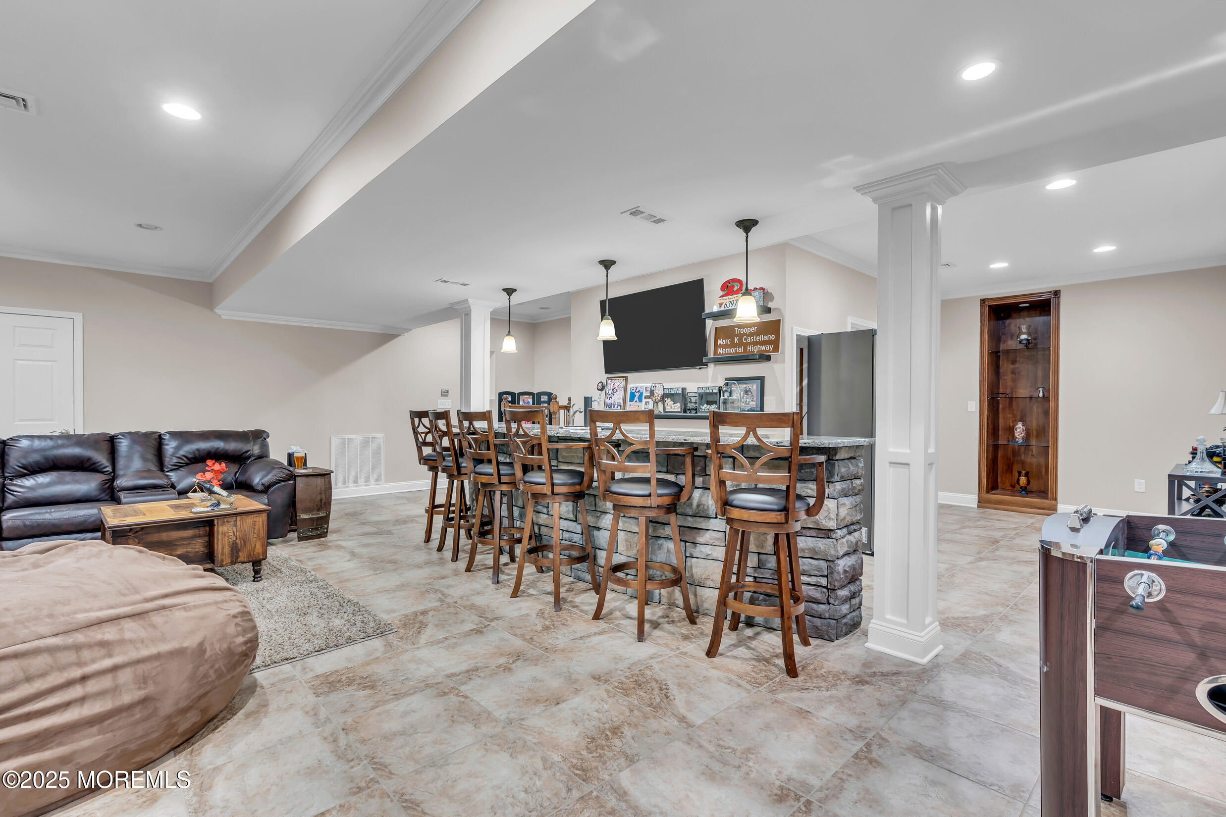 6 Firenze Road Jackson, NJ 08527 - Photo 39 of 57 a living room with furniture a flat screen tv and kitchen view