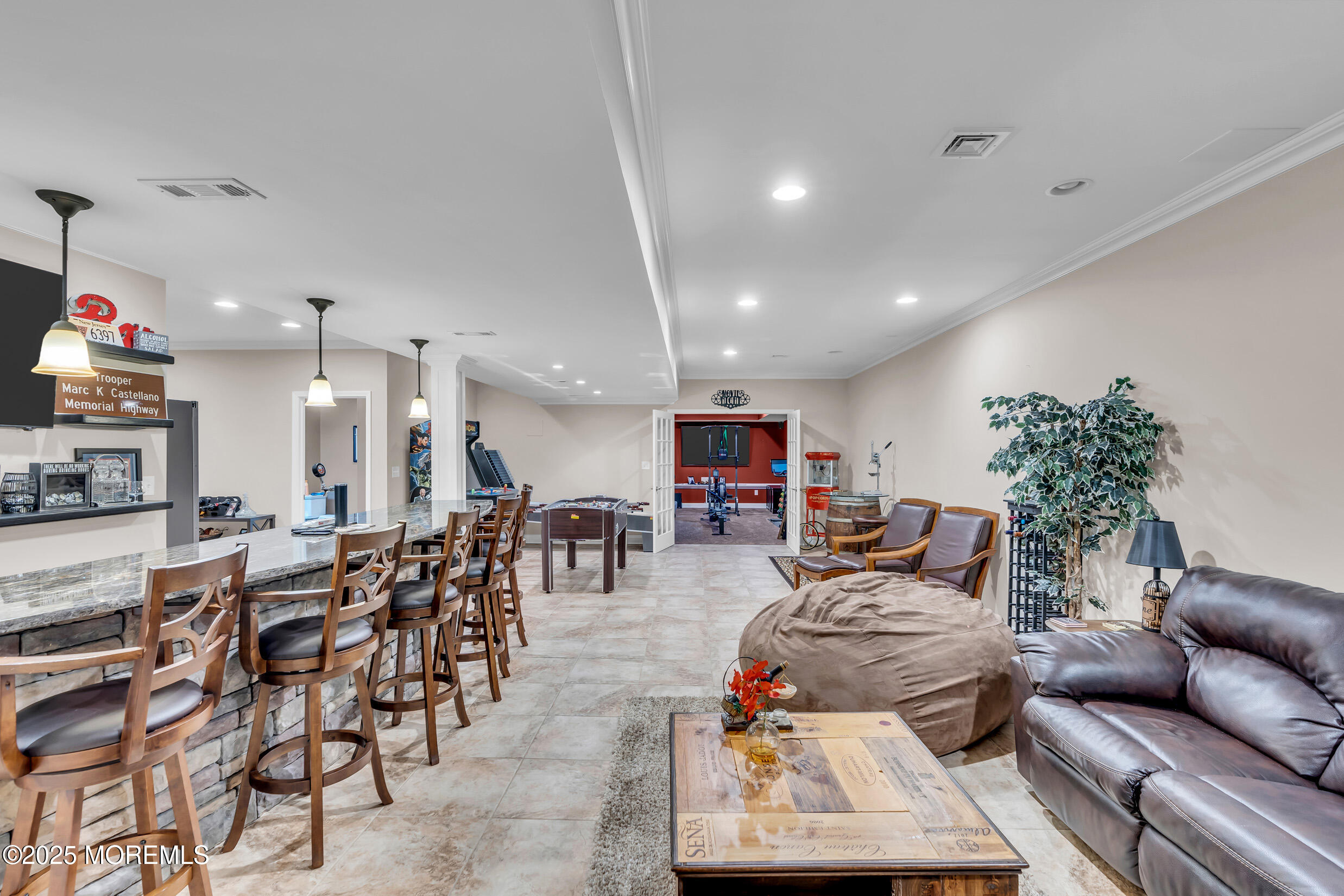 6 Firenze Road Jackson, NJ 08527 - Photo 40 of 57 a living room with furniture a dining table and a potted plant