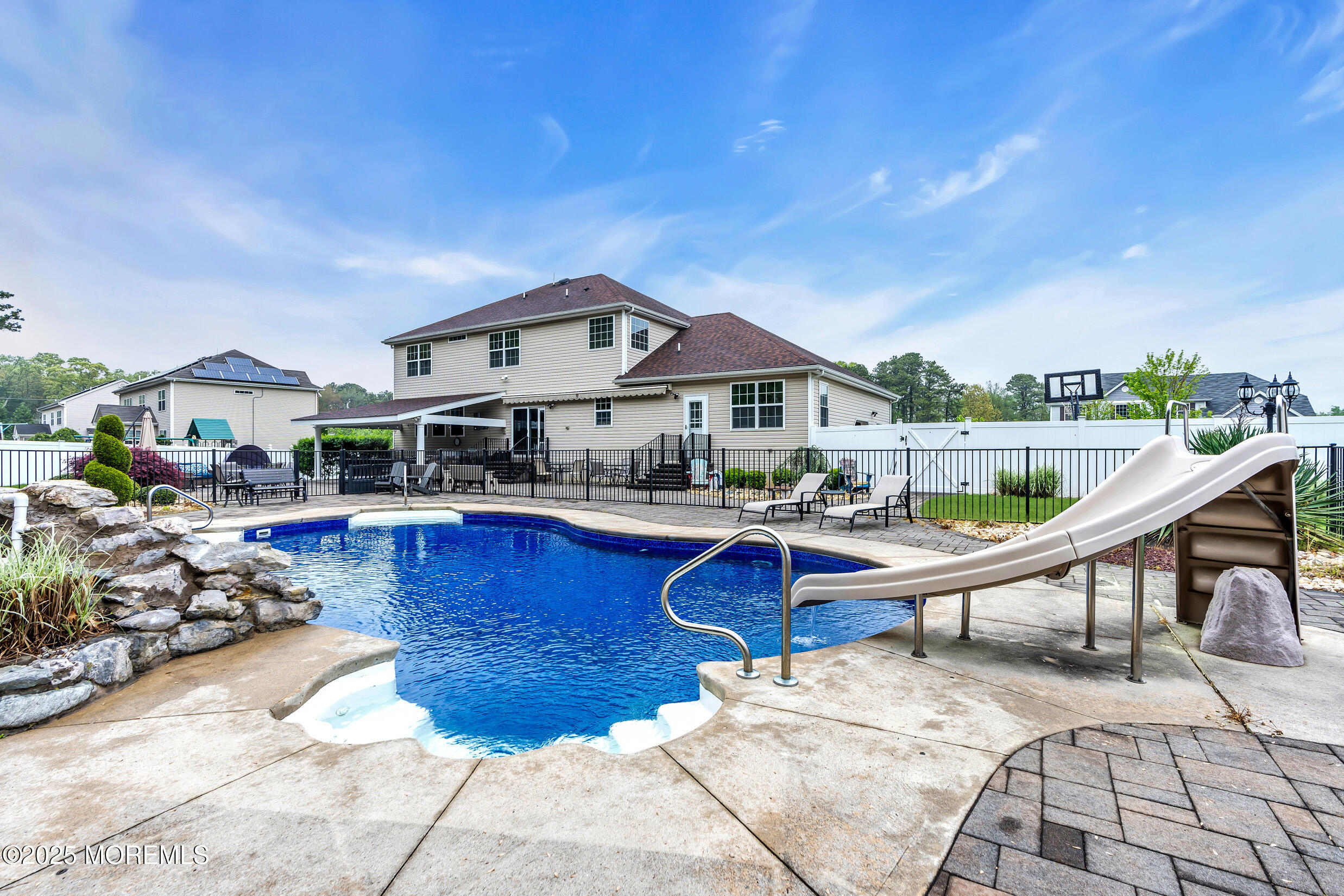 6 Firenze Road Jackson, NJ 08527 - Photo 42 of 57 a view of a swimming pool and lounge chairs