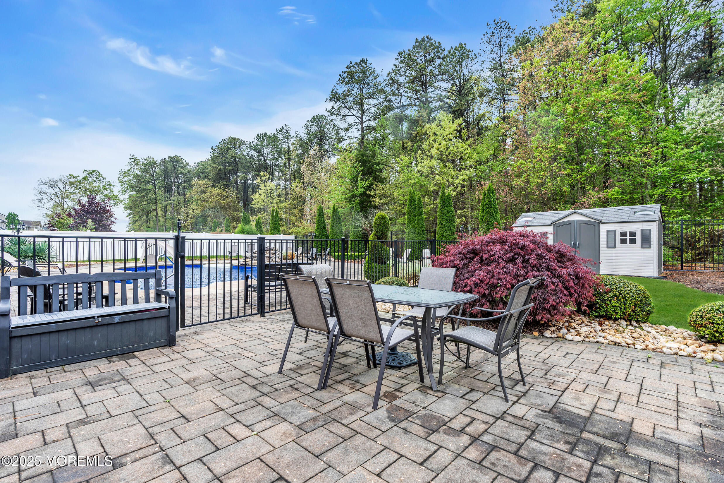 6 Firenze Road Jackson, NJ 08527 - Photo 46 of 57 a view of a chairs and table in the back yard of the house