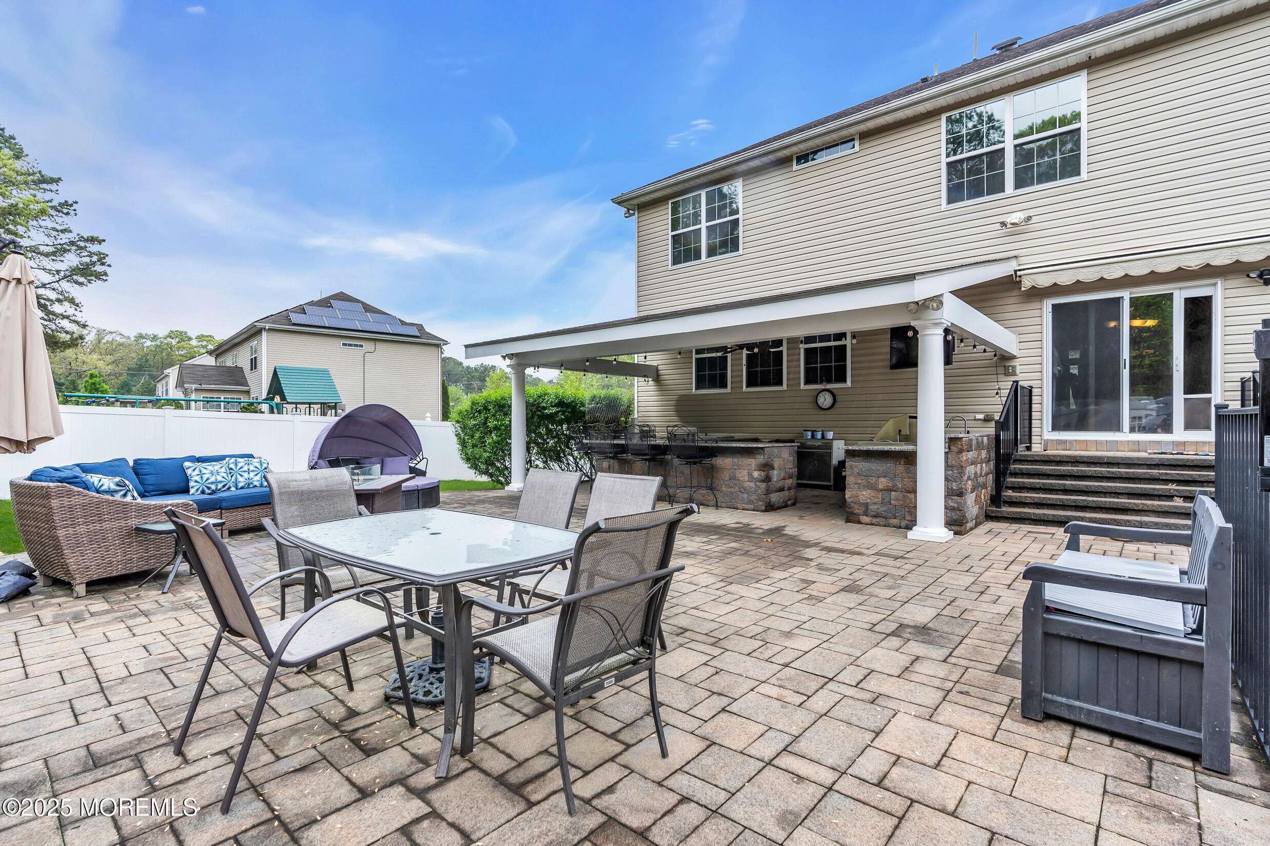 6 Firenze Road Jackson, NJ 08527 - Photo 47 of 57 a view of a patio with table and chairs with wooden floor and plants