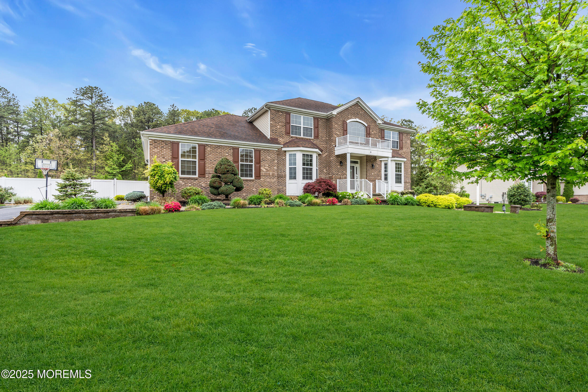 6 Firenze Road Jackson, NJ 08527 - Photo 5 of 57 a front view of a house with a garden