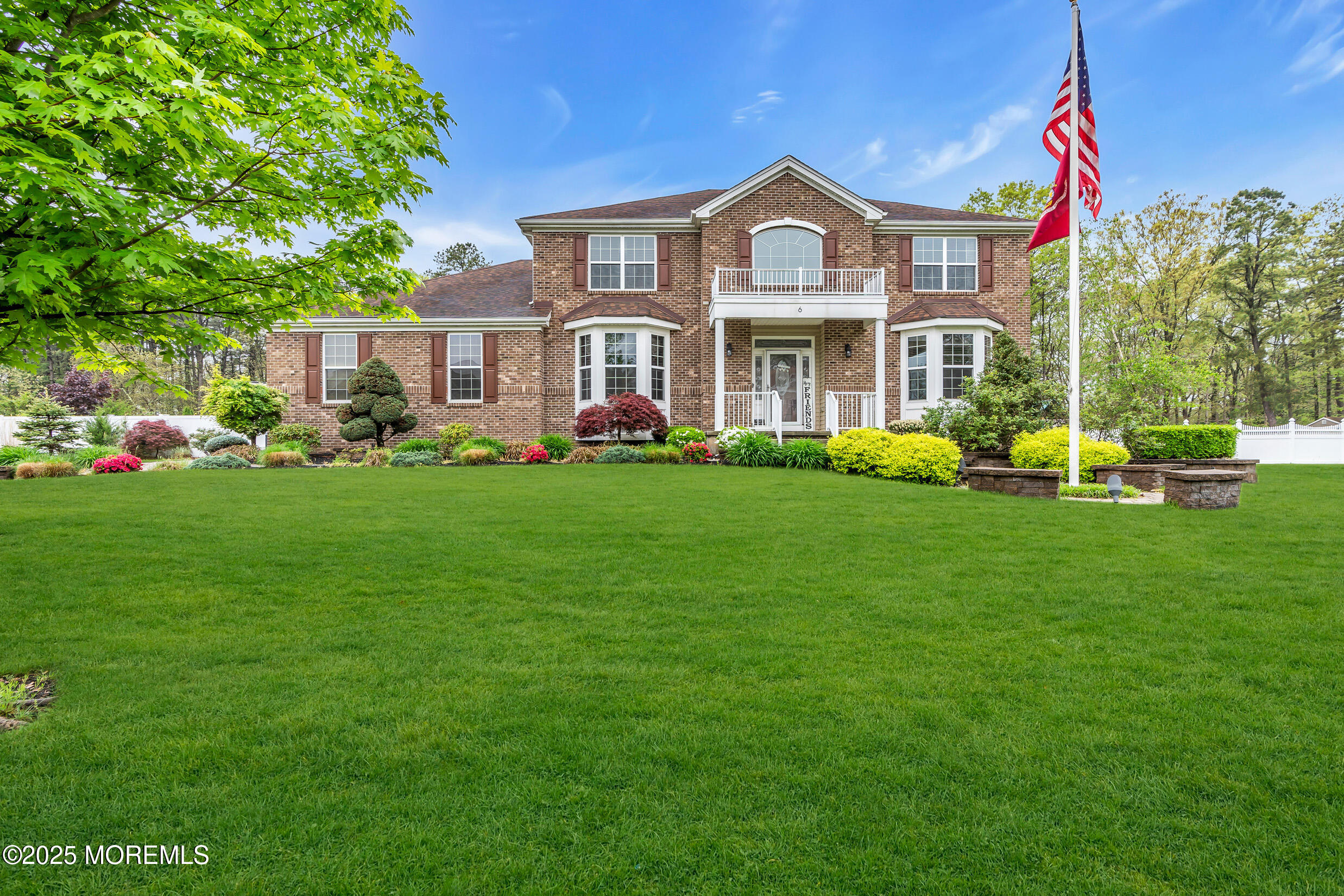 6 Firenze Road Jackson, NJ 08527 - Photo 6 of 57 a front view of a house with a garden