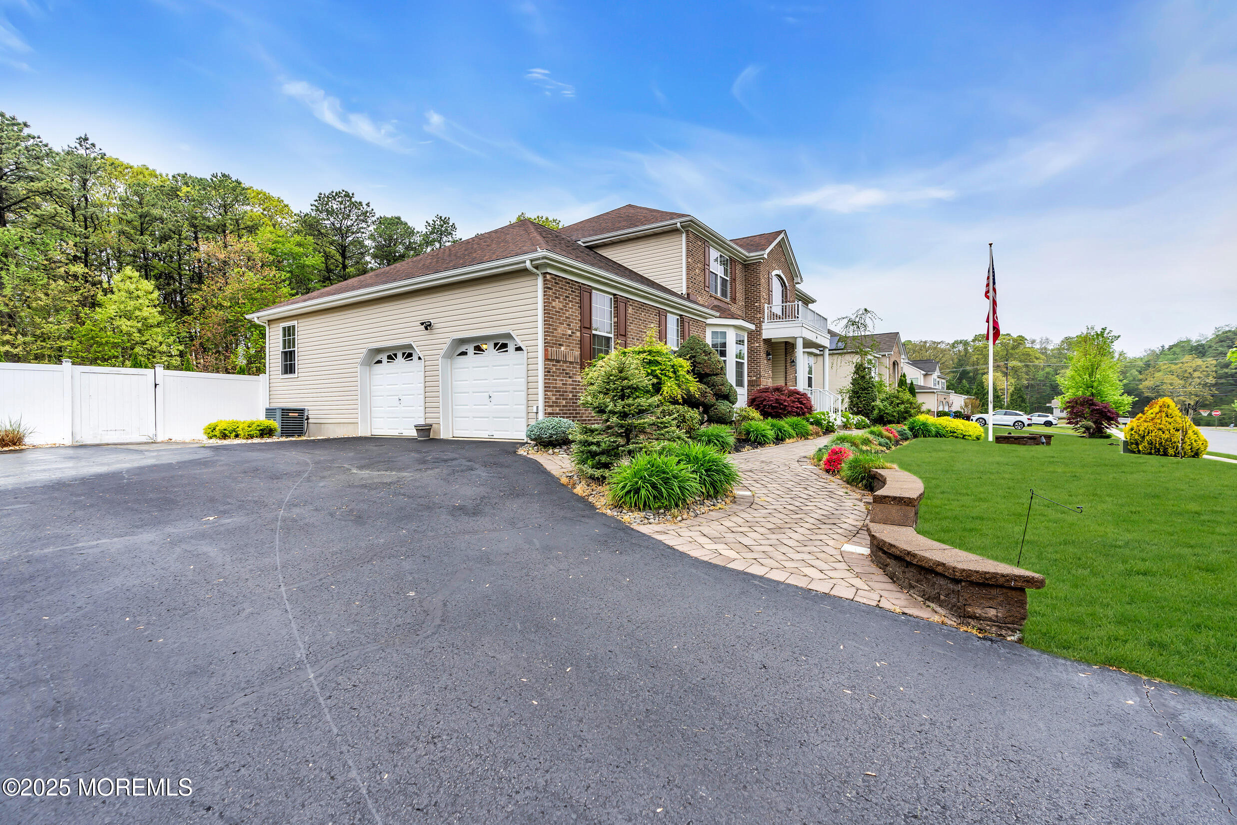 6 Firenze Road Jackson, NJ 08527 - Photo 9 of 57 a view of a white house with a big yard plants and large trees