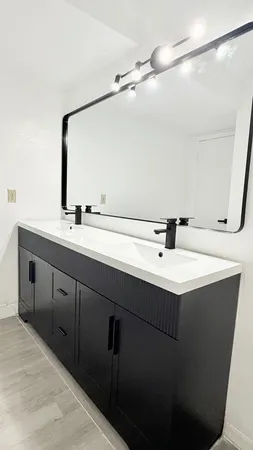 a bathroom with a sink and mirror
