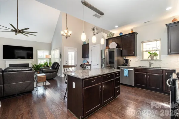 a kitchen with a stove and a sink
