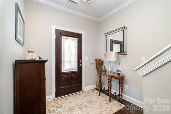 a view of a hallway with workspace and mirror