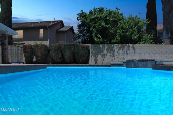 a view of a house with a swimming pool