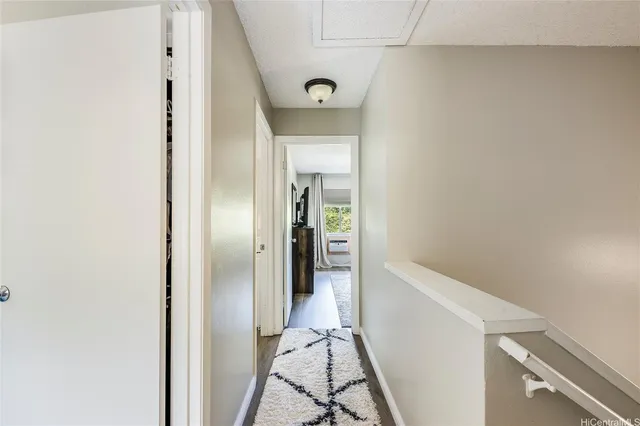 a view of a hallway view with staircase