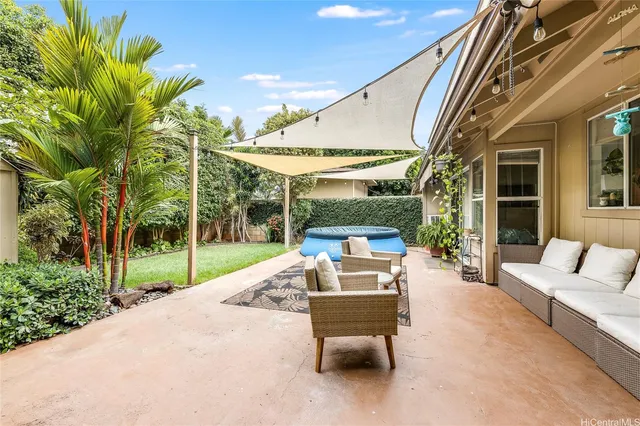 a outdoor space with patio the couches and a dining table with garden view