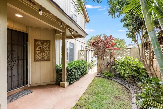 a view of a house with a flower garden
