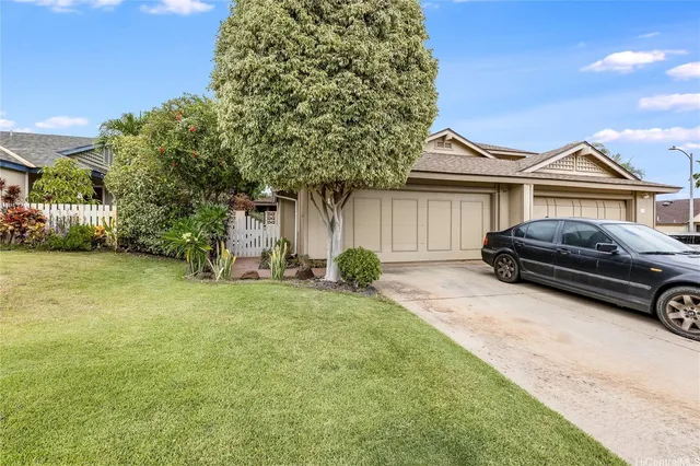 a house view with a garden space