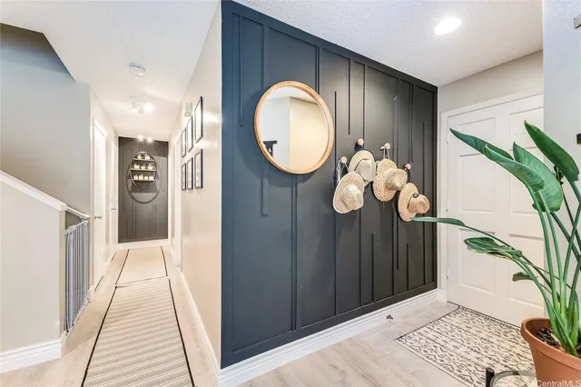 a view of entryway with wooden floor