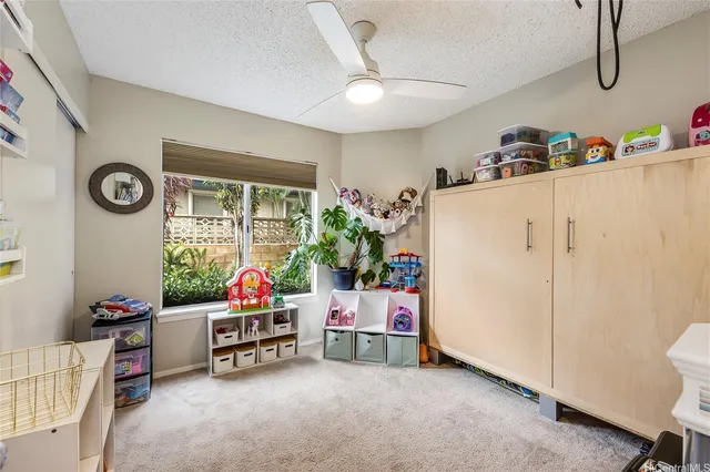 a living room with furniture and white walls