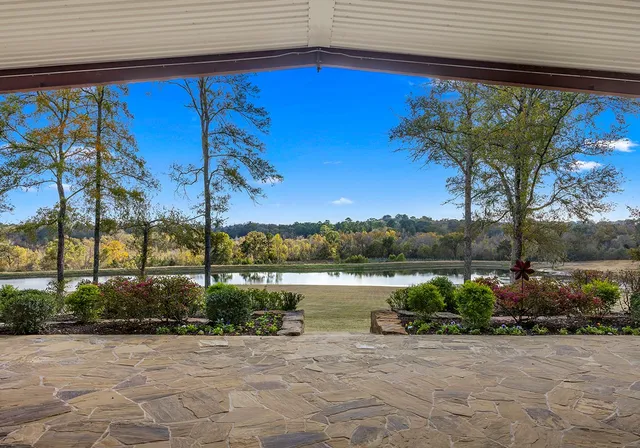 a view of a swimming pool with a patio