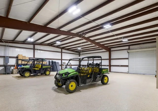 a view of garage with parked cars