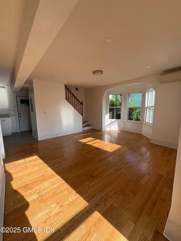a view of a livingroom with wooden floor